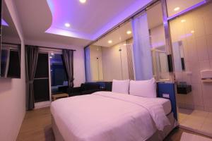 Säng eller sängar i ett rum på Lang Qin B&B