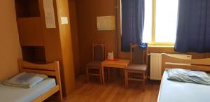 Llit o llits en una habitació de Hostel AV Palanka