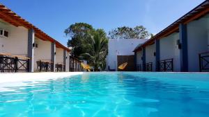 a view of the swimming pool at a resort at Positano Alona Beach Panglao in Panglao