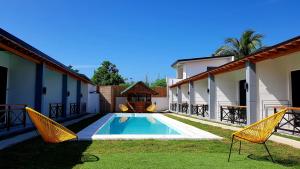 a swimming pool in the backyard of a house at Positano Alona Beach Panglao in Panglao