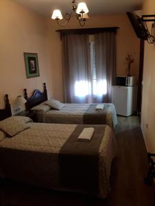 Ein Bett oder Betten in einem Zimmer der Unterkunft Hostal Rocio