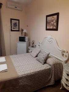 Ein Bett oder Betten in einem Zimmer der Unterkunft Hostal Rocio