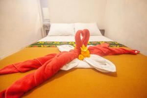 Postel nebo postele na pokoji v ubytování Putra Dadi Guest House