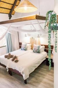 a bedroom with two beds with towels on them at Okahandja Country Hotel in Okahandja