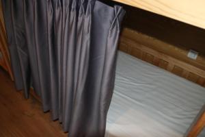 
A bed or beds in a room at The Phoenix Hostel Shanghai-LaoShan
