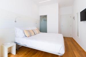 Posteľ alebo postele v izbe v ubytovaní Hotel Ligure