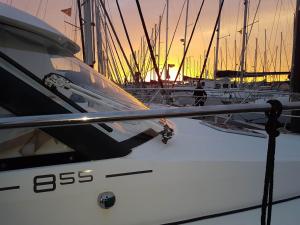 a boat is docked in a harbor at sunset at La Rochelle sur L'eau in La Rochelle