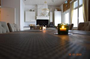 a large dining room table with a candle on it at Toranda Merilinna in Tornio
