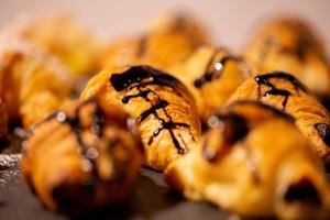 a group of pastries with chocolate sauce on them at Hotel Dimar in Valencia