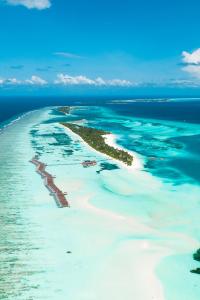 an aerial view of an island in the ocean at LUX* South Ari Atoll Resort & Villas in Maamigili