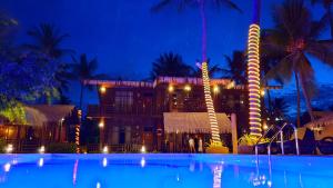 a resort with a swimming pool at night at Nilaveli Beach Resort - Level 1 Certified in Nilaveli +37 photos