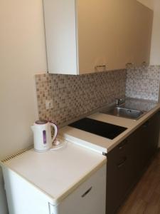 a kitchen with a sink and a counter top at Apartman Put in Baška +54 photos