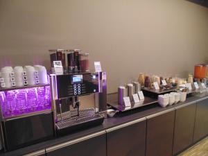 a coffee machine on a counter in a store at Gästehaus Auf dem Heiligen Berg B&B in Wuppertal