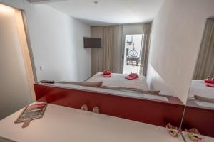 Voodi või voodid majutusasutuse Albergo Porta Verzasca toas