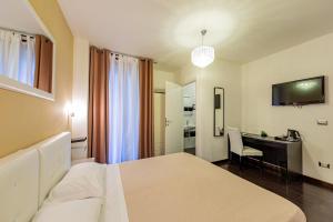 TV a/nebo společenská místnost v ubytování Sweetdreams Plaça Civica