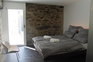 Voodi või voodid majutusasutuse Albergo Porta Verzasca toas