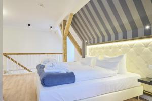 Ein Bett oder Betten in einem Zimmer der Unterkunft Sonnenresort Ettershaus