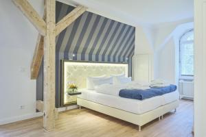 Ein Bett oder Betten in einem Zimmer der Unterkunft Sonnenresort Ettershaus