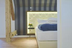 Ein Bett oder Betten in einem Zimmer der Unterkunft Sonnenresort Ettershaus