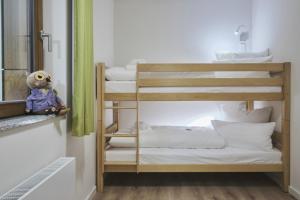 Ein Bett oder Betten in einem Zimmer der Unterkunft Sonnenresort Ettershaus