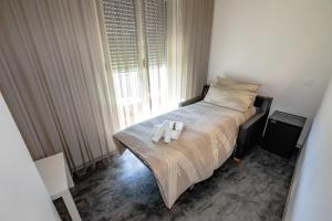 Voodi või voodid majutusasutuse Albergo Porta Verzasca toas