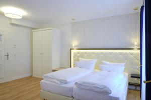 Ein Bett oder Betten in einem Zimmer der Unterkunft Sonnenresort Ettershaus