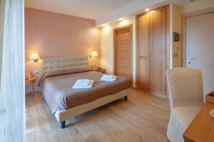 Postel nebo postele na pokoji v ubytování Maison Reale