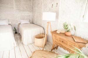 Postel nebo postele na pokoji v ubytování Dreamsea Bali