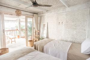 Postel nebo postele na pokoji v ubytování Dreamsea Bali