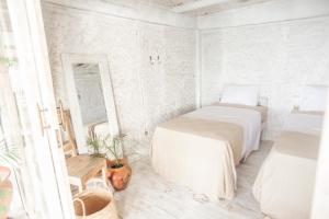 Postel nebo postele na pokoji v ubytování Dreamsea Bali