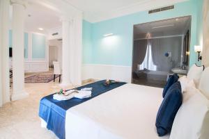 Postel nebo postele na pokoji v ubytování Hotel Baglio Basile