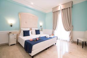 Postel nebo postele na pokoji v ubytování Hotel Baglio Basile