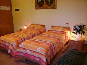 Postel nebo postele na pokoji v ubytování Albergo Corte Antica