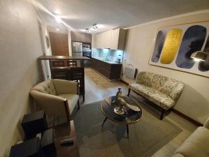 Χώρος καθιστικού στο Mojens Suites Santiago