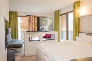 Ein Bett oder Betten in einem Zimmer der Unterkunft Sonnenresort Ettershaus