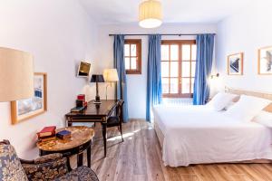 Ein Bett oder Betten in einem Zimmer der Unterkunft Hotel Spa Salinas de Imón