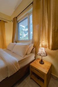 Postel nebo postele na pokoji v ubytování Mariners Bay Suites + 29 fotografií