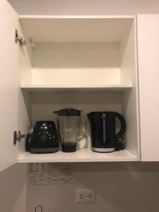 Η κουζίνα ή μικρή κουζίνα στο Asuncion Gracia Suites
