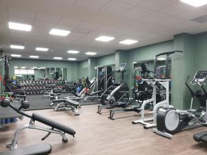 a gym with a lot of treadmills and machines at The Eliott Hotel in Gibraltar