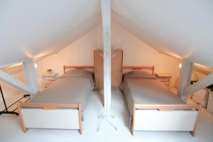 Voodi või voodid majutusasutuse Le Belvosgien toas