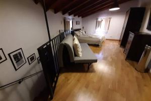 a living room with two beds and a couch at Lobetania in Moscardón