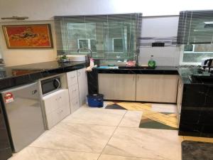 Kuchyň nebo kuchyňský kout v ubytování Home Suhaila