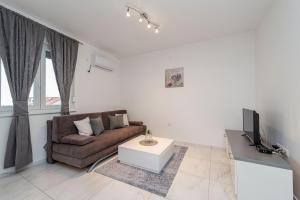 Posezení v ubytování Star 5 modern & centrally ap for 4