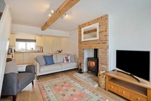 a living room with a tv and a fireplace at Off-street parking Lower rates for longer lets in York