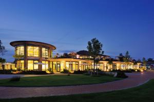a large building at night with lights at Landhotel RÖSSLE in Stimpfach
