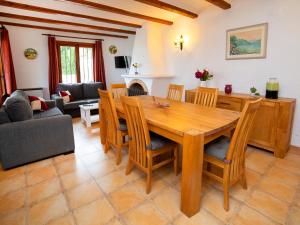 a living room with a wooden table and chairs at Villa Bel by Interhome in Pedramala