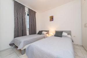 Postel nebo postele na pokoji v ubytování Star 6 modern & centrally ap for 6