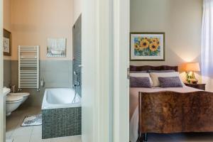 A bed or beds in a room at A due passi dal Castello