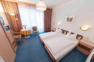 Postel nebo postele na pokoji v ubytování Hotel Goethehof