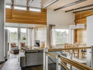 a living room with a couch and a table at Holiday Home Rukavuorenhuippu 23 b by Interhome in Ruka